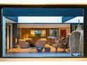 A view from a doorway of the living room with modern decor and a view of the kitchen at 5311 E Mitchell Dr, Phoenix, AZ 85018