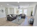 Open living room with a neutral color scheme and bright natural light from several windows at 6607 S Mitchell Dr, Tempe, AZ 85283