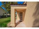 Charming front porch with decorative security door and updated tile at 14154 W Yosemite Dr, Sun City West, AZ 85375