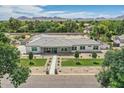 Stunning single story home with well-maintained desert landscaping, a gray roof, and block wall fencing at 19935 E Via Del Palo --, Queen Creek, AZ 85142