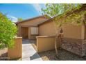 Inviting home exterior with desert landscaping and a covered entryway at 22191 W Tonto St, Buckeye, AZ 85326