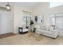 Bright living room with neutral decor, large windows, and a comfortable seating area that is very inviting at 25825 N 65Th Ave, Phoenix, AZ 85083