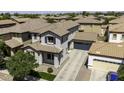 Aerial view of a two-story home with a tile roof, showing the property's layout and neighborhood surroundings at 3330 E Carla Vista Dr, Gilbert, AZ 85295