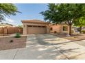 Single-story home boasts a two-car garage, xeriscaped front yard, and a spacious driveway at 4089 E Peach Tree Dr, Chandler, AZ 85249