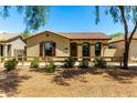 Charming single-story home with a well-maintained front yard and desert landscaping at 4495 E Woodside Way, Gilbert, AZ 85297