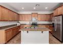 Spacious kitchen featuring granite countertops, stainless steel appliances, and an island at 4495 E Woodside Way, Gilbert, AZ 85297