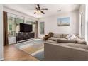 Inviting living room with comfortable seating, ample natural light, and stylish decor at 4495 E Woodside Way, Gilbert, AZ 85297