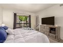 Bright bedroom featuring a large window with natural light, dresser, and cozy furnishings at 520 N Stapley Dr # 181, Mesa, AZ 85203