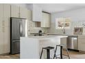 Well-equipped kitchen featuring a stainless steel refrigerator, and a functional island at 6351 E Waltann Ln, Scottsdale, AZ 85254