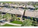 Attractive aerial view highlighting a neighborhood with coordinated homes, green spaces, and well-designed streets at 650 E Myrtle Pass, Queen Creek, AZ 85140