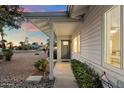 Cozy front porch of a single-Gathering home with a well-manicured yard and an inviting entrance at 8228 E Oak St, Scottsdale, AZ 85257