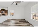 Bright living room featuring hard surface floors, neutral walls, and multiple windows for natural light at 854 S San Marcos Dr # A12, Apache Junction, AZ 85120