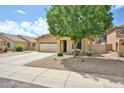 Charming single-story home with a well-manicured front yard and desert landscaping at 17845 W Calavar Rd, Surprise, AZ 85388