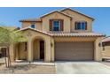 Two-story home featuring a two car garage, covered entrance and manicured yard at 2736 S 172Nd Ln, Goodyear, AZ 85338
