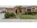 Charming home with stone accents, a well-manicured lawn, and a two-car garage at 3170 E Lynx Pl, Chandler, AZ 85249