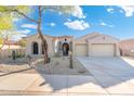 Charming single-story home with well-maintained desert landscaping, ample parking, and a two car garage at 12428 S 179Th Ln, Goodyear, AZ 85338