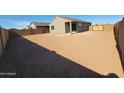 Expansive backyard, ready for landscaping, with ample space for outdoor living and entertaining at 322 S San Christo Ln, Casa Grande, AZ 85194