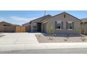Welcoming single-story home with a spacious driveway, desert landscaping, and charming shuttered windows at 322 S San Christo Ln, Casa Grande, AZ 85194