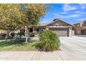 Charming single-story home with a well-manicured lawn and mature desert landscaping in a desirable neighborhood at 4968 E Westchester Dr, Chandler, AZ 85249
