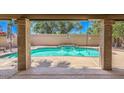 Sparkling pool with water feature, surrounded by a spacious covered patio at 15846 S 33Rd Pl, Phoenix, AZ 85048