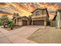 Attractive two-story home with a two-car garage and drought-resistant landscaping at 3054 W Eagle Claw Dr, Phoenix, AZ 85086