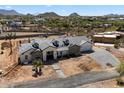Beautiful home with a large brick paver driveway and desert landscape views at 3323 N 81St St, Mesa, AZ 85207
