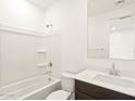 Clean bathroom featuring a shower-tub combo, white tile surround, and vanity at 4182 W Lisa Ln, San Tan Valley, AZ 85144