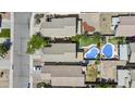 An aerial view shows a neighborhood with backyard pools, landscaping, and well-maintained homes at 4712 E Amberwood Dr, Phoenix, AZ 85048