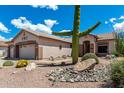 Beautiful desert landscaping with a large saguaro cactus in the front yard at 5381 S Emerald Desert Dr, Gold Canyon, AZ 85118