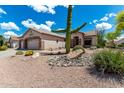 Beautiful desert landscaping with a large saguaro cactus in the front yard at 5381 S Emerald Desert Dr, Gold Canyon, AZ 85118