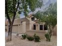 Home exterior with minimal landscaping and a decorative breezeway over the front walkway at 8863 S Grandview Dr, Tempe, AZ 85284
