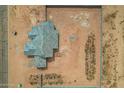 Aerial top-down view of new home construction featuring desert landscaping and privacy wall at 9486 W Sandstone Mountain Dr, Casa Grande, AZ 85194