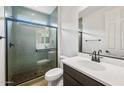 Modern bathroom boasts a glass-enclosed shower with subway tile and dark fixtures at 13503 W Calle De Baca --, Peoria, AZ 85383