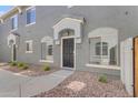 Inviting townhome exterior with a covered entryway and desert-friendly landscaping at 2402 E 5Th St # 1621, Tempe, AZ 85288