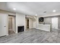 Spacious living room featuring a fireplace and an open layout, complemented by stylish flooring at 30 E Brown Rd # 1048, Mesa, AZ 85201