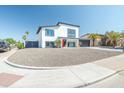 Contemporary two-story home with a front yard of decorative gravel at 4530 W Paradise Dr, Glendale, AZ 85304