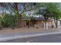 Charming single-story home with desert landscaping and a cozy front entrance at 5008 E Nisbet Rd, Scottsdale, AZ 85254