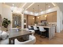 Elegant kitchen boasting an island with marble countertops, sleek cabinetry, and a custom wine rack at 6202 E Larkspur Dr, Scottsdale, AZ 85254