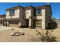 Two-story home with low maintenance yard and desert landscaping and neutral color palette at 10528 W Jessie Ln, Peoria, AZ 85383
