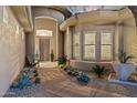 Stunning front entrance with mature cacti and desert landscaping at 10811 E Acoma Dr, Scottsdale, AZ 85255