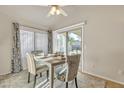 Cozy dining area with a sliding glass door and stylish furniture at 1120 N Val Vista Dr # 10, Gilbert, AZ 85234