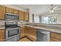 Well-lit kitchen featuring stainless steel appliances and ample cabinet space at 1120 N Val Vista Dr # 10, Gilbert, AZ 85234