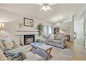Inviting living room with a fireplace, neutral tones, and comfortable seating at 1120 N Val Vista Dr # 10, Gilbert, AZ 85234