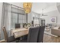 Dining room with a decorative chandelier and large window at 11333 N 92Nd St # 2049, Scottsdale, AZ 85260