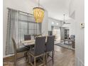 Dining room with a decorative chandelier and large window at 11333 N 92Nd St # 2049, Scottsdale, AZ 85260