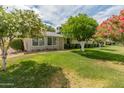 Well-maintained home boasting lush landscaping and curb appeal at 12714 W Copperstone Dr, Sun City West, AZ 85375