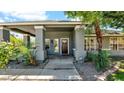 Inviting front porch with decorative columns and well-maintained landscaping at 139 W Granada Rd, Phoenix, AZ 85003