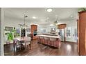 Spacious kitchen with a large center island, stainless steel appliances, and dining area at 139 W Granada Rd, Phoenix, AZ 85003