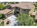 Stunning two-story home featuring a tile roof, private balcony, and a spacious three-car garage at 19943 E Strawberry Dr, Queen Creek, AZ 85142