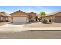 Charming single-story home with a two-car garage and desert landscaping at 204 S Valle Verde --, Mesa, AZ 85208